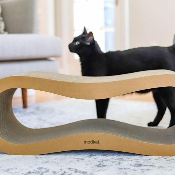 Modkat Cat Scratcher in front of black cat