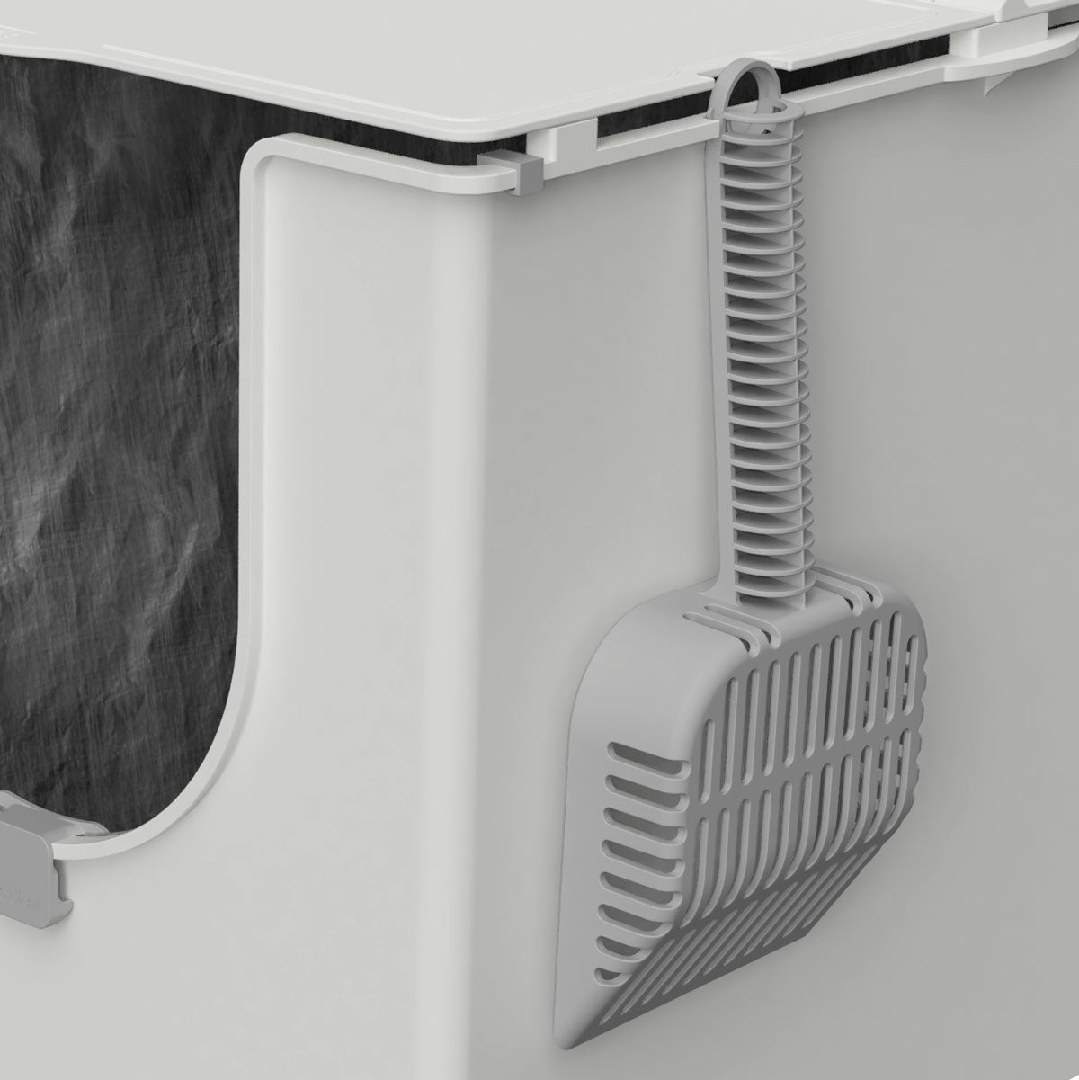 Slotted Scoop hanging on the Flip Litter Box